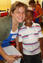 Back to School Store boy and volunteer